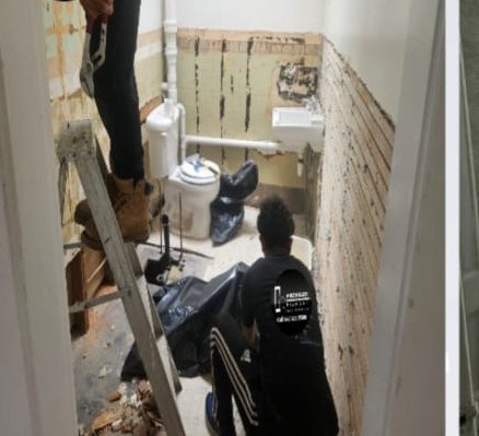 Before: bathroom taken down to the studs during demolition